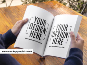  Person_Hand_Holding_Magzine_Mockup_Design_www.mockupgraphics.com